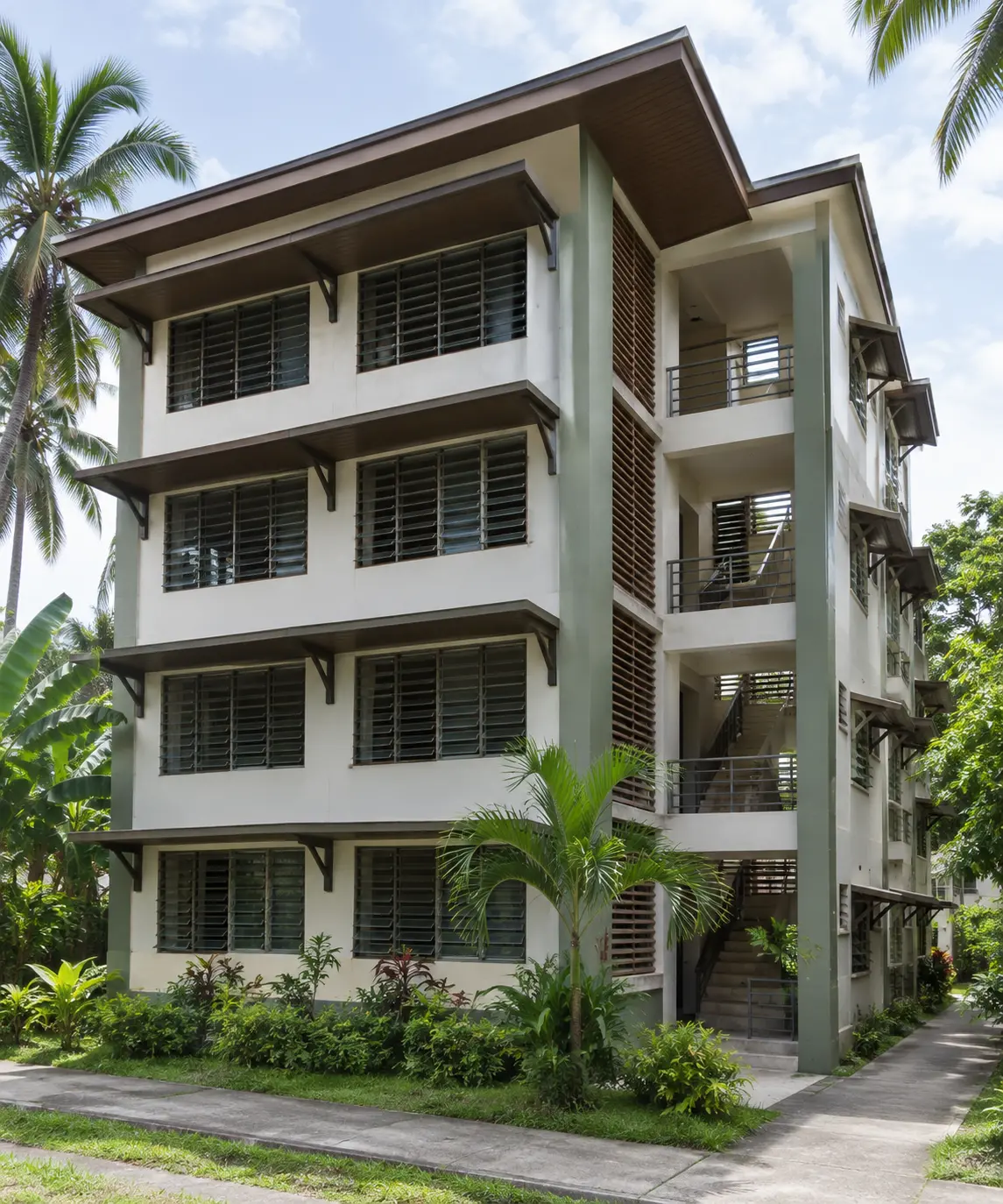 Mid-rise walk-up residential building in the Philippines with shading devices and louvered openings for passive cooling