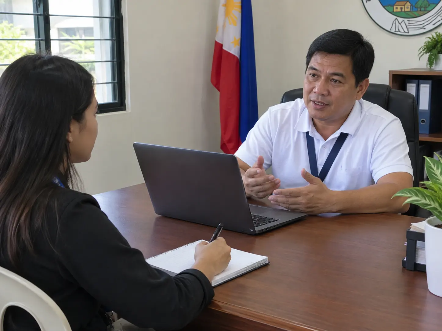 A student interviewing staff to gather requirements for a capstone system